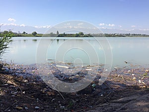 Environmental disaster. The pollution of the lake, the pond. The accumulation of plastic bottles in the water. Eco.