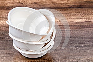 Environmental eco friendly natural compostable food container round shape bowl on wooden background