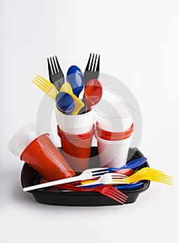 Bright plastic tableware isolated on white background