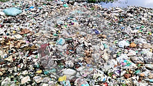 Environmental pollution by dumping different types of garbage in water