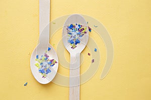 Environmental pollution and water microplastic. Micro plastic with spoon