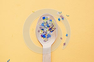 Environmental pollution and water microplastic. Micro plastic with spoon