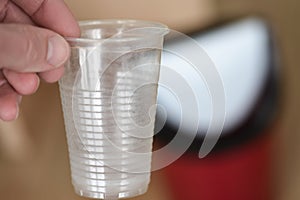 Environmental problem The used plastic cup is thrown into the trash can