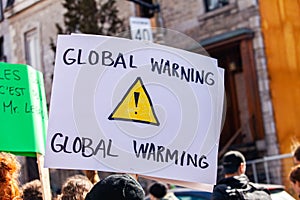 Environmental sign held by protestor