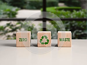 Environmental sustainability, ecology and recycling concept. Wooden cubes with the word zero waste and recycling symbol