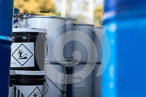 `Environmentally hazardous` placard warning sign on chemical box.