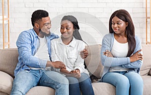 Envy Afro Girl Sitting On Sofa Next To Her Dating Friends