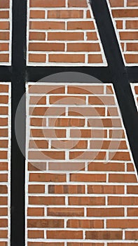 Enxaimel house cluse-up. Wood and brick wall. German style. photo