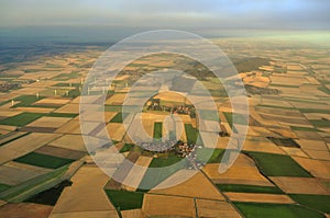 EOLIC FIELD AND TOWN FROM THE SKY IN GERMANY photo