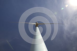 Eolic wind Turbines on a modern windmill farm for alternative energy generation