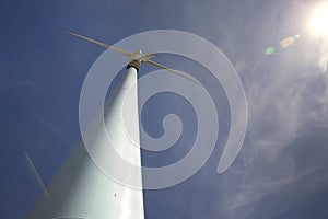 Eolic wind Turbines on a modern windmill farm for alternative energy generation