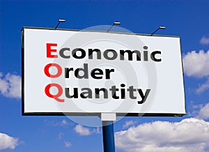 EOQ economic order quantity symbol. Concept words EOQ economic order quantity on big white billboard against beautiful blue sky