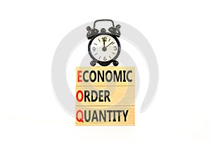 EOQ economic order quantity symbol. Concept words EOQ economic order quantity on wooden blocks on a beautiful white table white