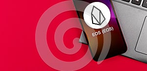 EOS symbol. Trade with cryptocurrency, digital and virtual money, banking with mobile phone concept. Business workspace