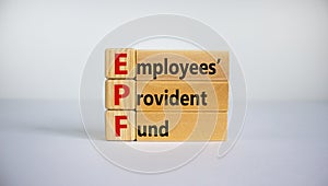 EPF, employees provident fund symbol. Wooden blocks with words `EPF, employees provident fund`. Beautiful white background, copy