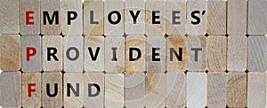 EPF, employees provident fund symbol. Wooden blocks with words `EPF, employees provident fund`. Beautiful wooden background, cop