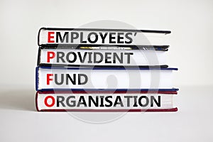 EPFO, employees provident fund organisation symbol. Concept words `EPFO, employees provident fund organisation` on books.