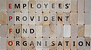 EPFO, employees provident fund organisation symbol. Wooden cubes with words `EPFO, employees provident fund organisation.