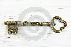 Ephesians 6 verse 19 engraved on an antique brass key photo