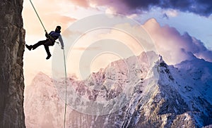 Epic Adventurous Extreme Sport Composite of Rock Climbing Man Rappelling from a Cliff