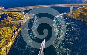 Epic aerial landscape from beautiful northern Norway with bridge over whirlpools