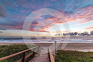 Epic beach landscape with sunrise sky and beach entrance