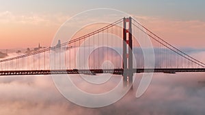 Epic cinematic pink clouds around scenic red Golden Gate bridge, San Francisco