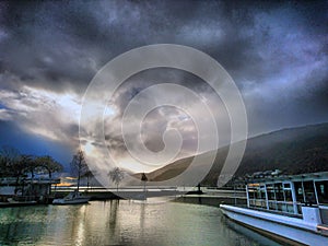 Epic clouds over the lake of biel photo