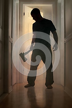 Epic concept with man holding axe inside a smoking house photo