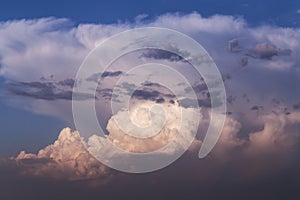 Epic dramatic storm sky. Big large white cumulus clouds against blue sky background, cloud abstract texture, thunderstorm