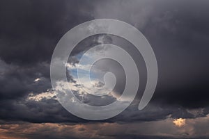 Epic Dramatic Storm sky, dark grey clouds against blue sky background texture, thunderstorm