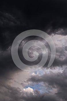 Epic dramatic Storm sky, dark grey and white cumulus clouds on blue sky background texture, thunderstorm