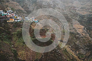 Epic Fontaihas village. Settlement in the rocky coast of Santo Antao island. Houses nestle into the bluff ridge wall