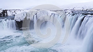 Epic icy waterfall smooth pouring heavy water