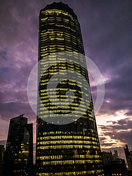 Epic and magical purple cloudy sunset around the WTC towers in Abu Dhabi