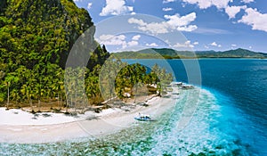 Epic Pinagbuyutan Island, El Nido, Palawan, Philippines. Aerial drone view of remote secluded tropical white sandy beach