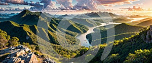 Epic tropical landscape, banner - view of a mountainous area with rainforest and river at sunrise