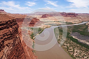 Epic view of Colorado river and Utah desert from Hite Overlook vista point on a very hot, sunny day of spring. Red mesa
