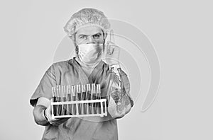Epidemic threshold. Man in medical lab inspecting samples biological material. Epidemic disease. Virus concept. Epidemic