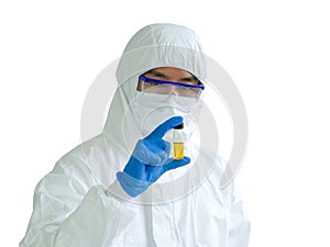 Epidemiological researchers in virus protective clothing are casually looking at yellow chemical in glass bottle. Coronavirus