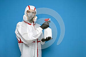 Epidemiologist in a chemical protective suit holds a spray bottle on a isolated background, man, biologist, scientist, virologist