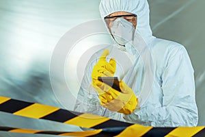 Epidemiologist using smartphone in hospital virus infection quarantine