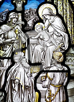 The Epiphany in stained glass (three kings visiting baby Jesus)