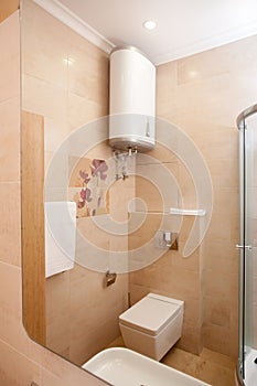 Epmty minimalistic interior background, bathroom of modern apartment, shower cabin, toilet, lavatory, mirror and basin