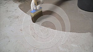 Epoxy floor in warehouse factory japan construction site ,polishing stone concrete. Processing the floor with a brush with water