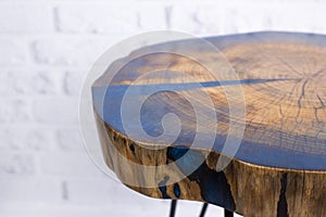 Epoxy resin table in loft style. Designer furniture. Cut wood table