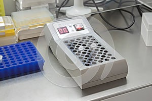 Eppendorf vials with the DNA samples in thermostat in the genetic laboratory, conducting polymerase chain reaction analysis