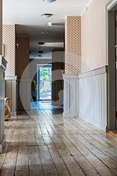 Epty Hotel Hallway with Wooden Board Floor