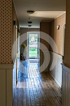 Epty Hotel Hallway with Wooden Board Floor