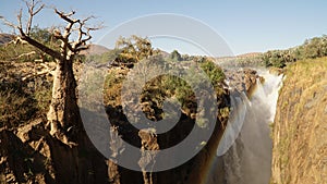 Epupa Falls Waterfall with Baobab trees at the border of Namibia and Angola in Kaokoland, Southern Africa. photo